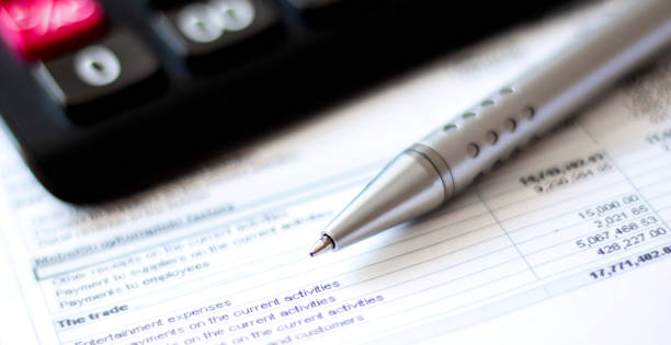 istock Calculator and pen on diagram chart background 1266338591