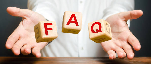 istock Cubes thrown by a man make word abbreviation acronym FAQ (frequently asked questions). Instructions and rules. Avoid frequent errors. Convenient form of answers explanations for users and customers. 1266341494