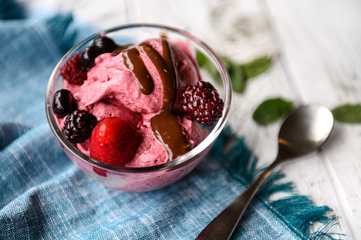 Delicious Raspberry Ice Cream in a Bowl, Summer Dessert on Bright Background