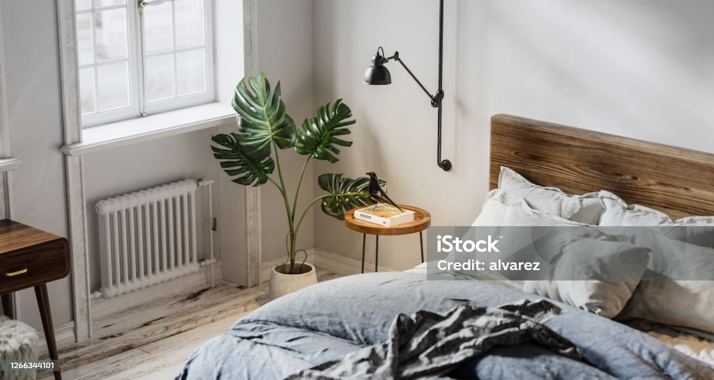 Digitally generated domestic bedroom interior Digitally generated domestic bedroom interior. 3d render of bedroom with bed, heater, potted plant and side table. Bedroom Stock Photo