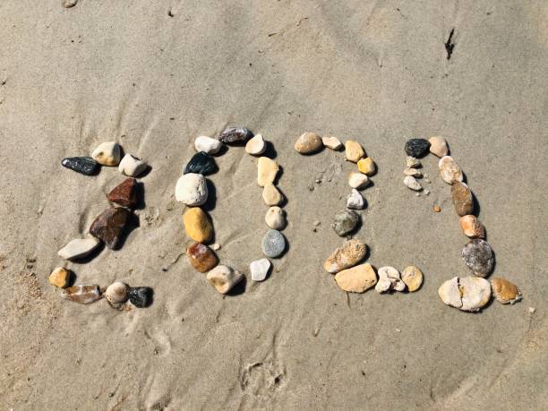 istock Rocks at Beach Shaped into Year 2021 1266346138
