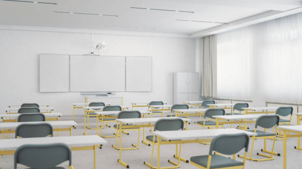 istock Empty Classroom Organized For Social Distancing 1266347082