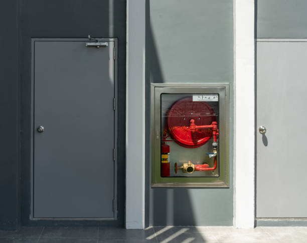 istock Fire hoses packed inside of red emergency box at the wall 1266352173