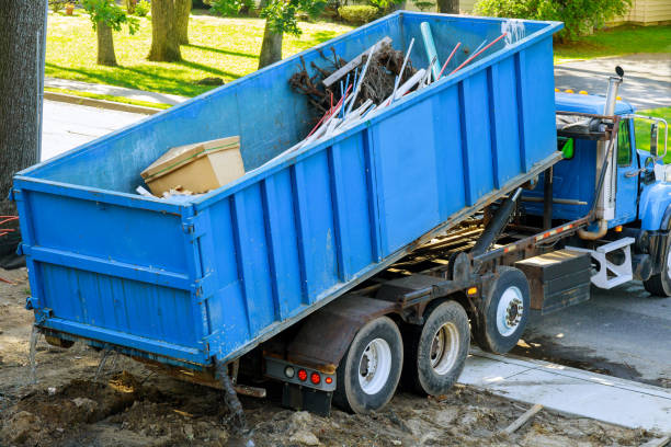 istock Loading the garbage container old and used construction material in the new building construction work site. 1266355860