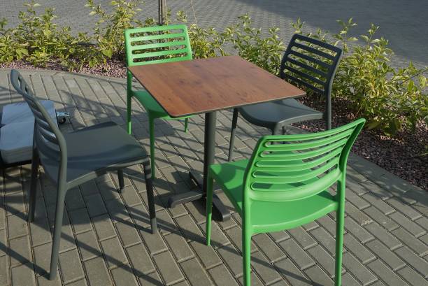 istock plastic chairs by the brown table stand on a gray sidewalk outside 1266357416
