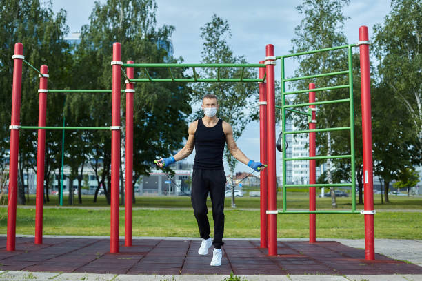istock athletic man in a protective mask at practice in the morning 1266359533