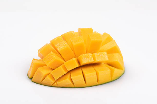 mango slice with green leaves isolated on white background