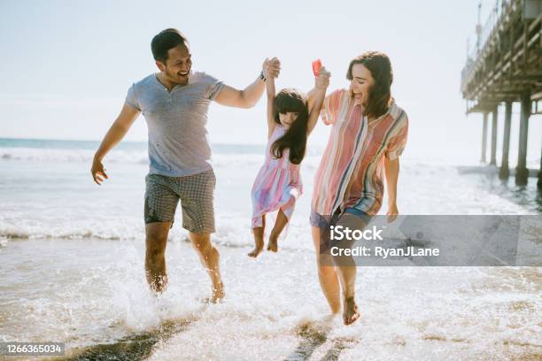 Loving Family Enjoying Sun At Los Angeles Beach Stock Photo - Download Image Now - Family, Beach, Happiness