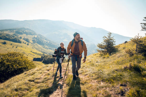 istock Young couple hiking in the mountains 1266371382
