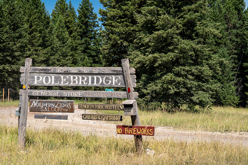 Polebridge, Montana - July 28, 2020: Welcome to Polebridge sign, a small community within Glacier National Park, with limited visitor services