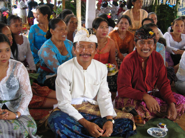Bangli, Bali, Indonesia - August 7, 2010. Balinese attendees at a Hindu ceremony in Bangli, Bali.