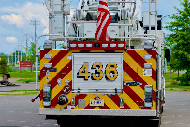 Fairfax County (Virginia) Fire Ladder Truck #436 Chantilly, Virginia / USA - August 14, 2020: View of the back of Fairfax County Fire & Rescue Ladder Truck 436 from Engine 36. firefighter shield stock pictures, royalty-free photos & images