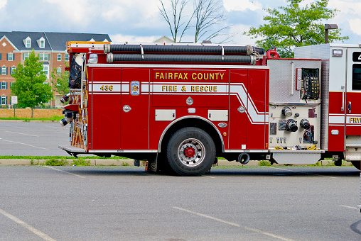 Chantilly, Virginia / USA - August 14, 2020: View of a Fairfax County Fire & Rescue pump truck parked in a parking lot.