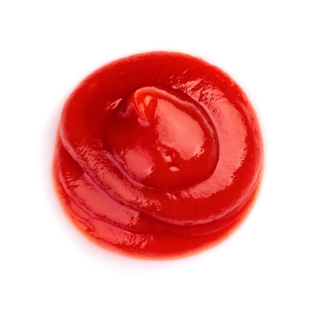 istock Red ketchup tomato sauce closeup isolated on white background 1266376827
