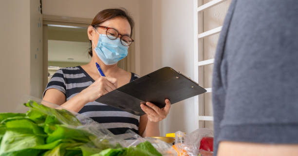 istock Asian customer online order grocery 1266377525