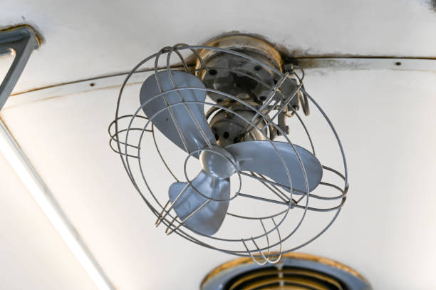istock Old electric fan hung on the ceiling. 1266380232