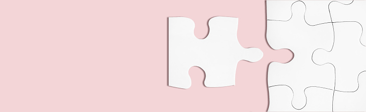 Matching puzzle piece on pink background. Business teamwork, partnership concept. Connecting or joining to company idea. Successful decision, solution of problem. Business success metaphor. Copy space