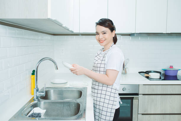 istock Woman wearing an apron , kitchen, cooking 1266383928
