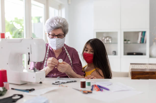 istock Grandma making a fabric mask for covid-19 1266384079