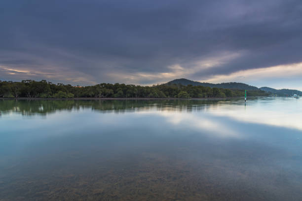 istock Soft Cloudy Sunrise over the Bay 1266384635