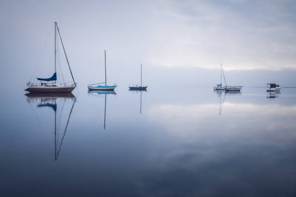 istock Misty Morning with Boats and Reflections on the Bay 1266384787