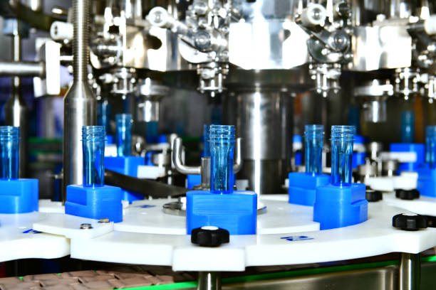 istock Pharmaceutical automatic production line machine conveyor with vial glass bottles. 1266385759