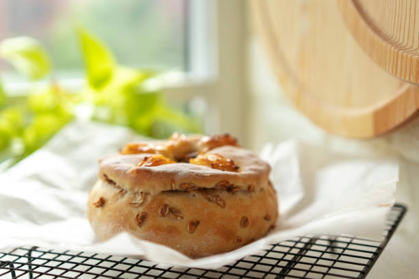 A freshly baked flatbread on a blue cloth in a wicker basket