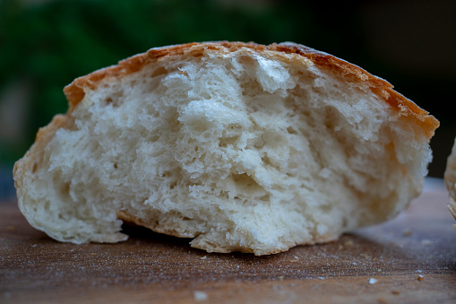 Organic sourdough bread with sunflower seeds, sesame and flax on a white background. Healthy bread recipe.