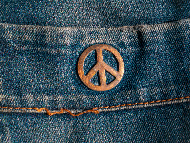 istock Iron sign of a pacifist on denim. 1266387879