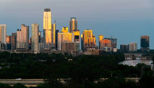 istock Golden Reflections of sunset on the growing Modern Skyline 1266389178
