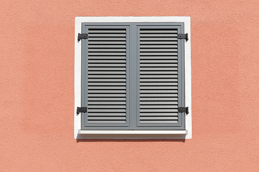 Close-up of a shuttered windows to a building in Strasbourg, France