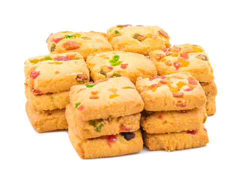 Heap of Delicious Tutti Frutti Cookies or Biscuits Also Know as Candied Fruits Cookies isolated on White Background