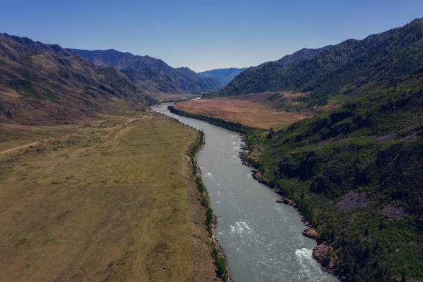 istock Mountain valley aerial drone view, river, summer mountains landscape 1266391691