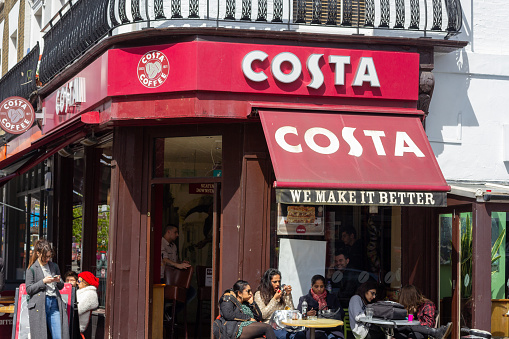 Costa Coffee in Camden, London. This is a British coffeehouse chain founded in 1971. People can be seen outside.