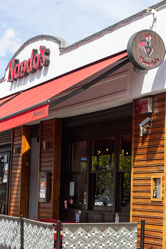 Nando's in Camden,. London (Chalk Farm). Pictured is  The Rooster of Barcelos, a Portuguese symbol depicting the Portuguese heritage of this South African-founded chain.