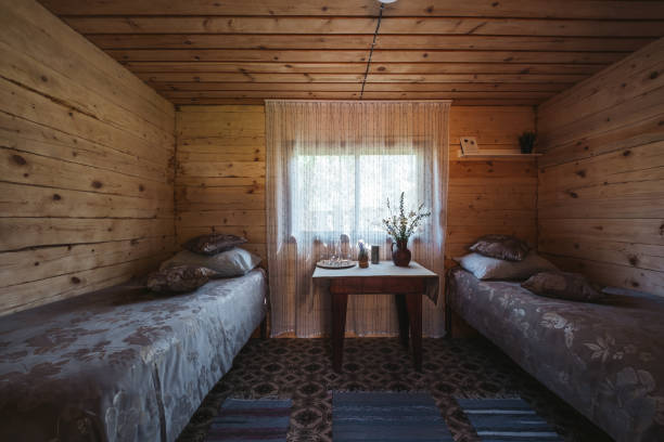 istock Wooden simple rustic bedroom interior in mountain summer resort 1266396539