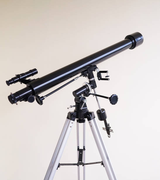 istock Telescope on a white wall background, Telescope on the equatorial tripod for sky observation, 1266396570