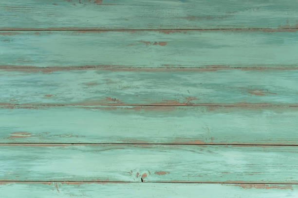 istock Wood rustic light blue or green background. Old wooden table, top view. 1266397140