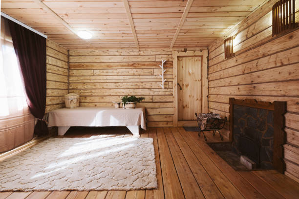 istock wooden bath, sauna interior. Dressing room, steam room, simple rustic decor 1266397382