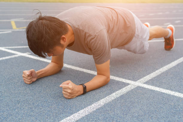 istock Fitness man doing planking exercise - workout concept 1266409924