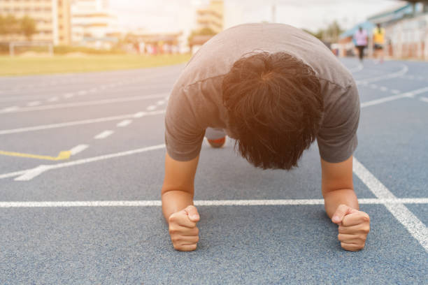 istock Fitness man doing planking exercise - workout concept 1266409929