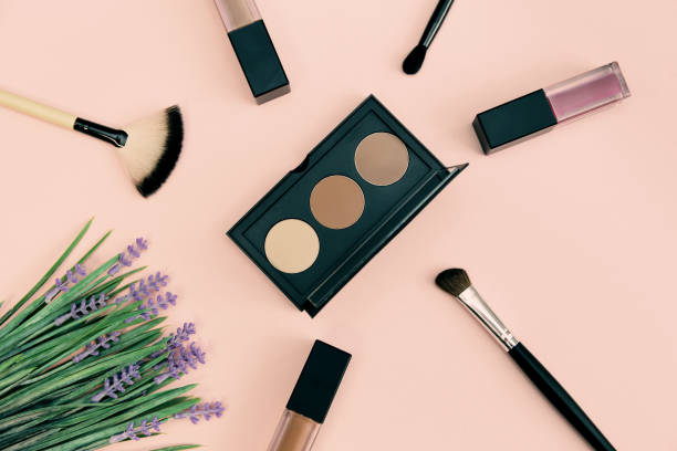 istock Decorative cosmetics with makeup brush  on colorful background. 1266411914