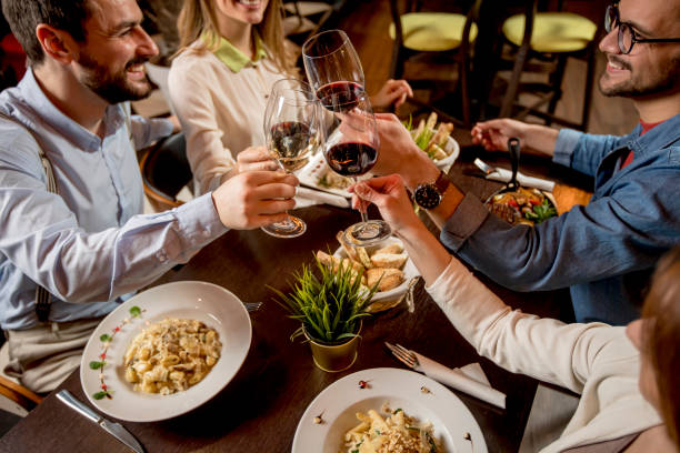 istock Young people having dinner in the restaurant 1266413162