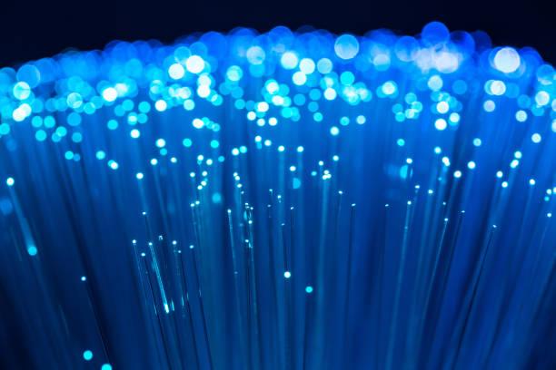 istock Close up fiber optics in blue. Concept global data communication 1266413393