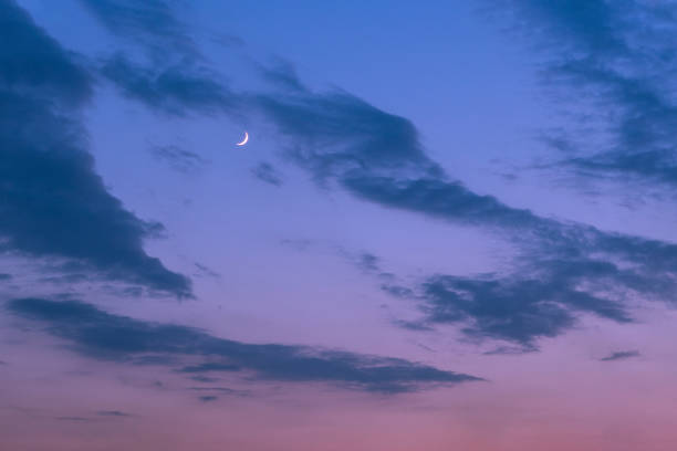 istock Crescent moon on night blue sky with clouds. Nature background. 1266415209