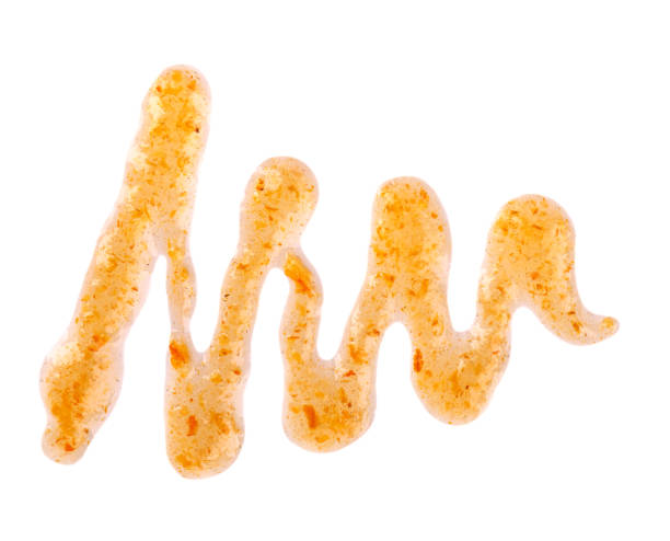 istock Orange thick jam drizzle, isolated on white background. Mandarin marmalade, Sea buckthorn jam, topping drops. Top view. 1266415529
