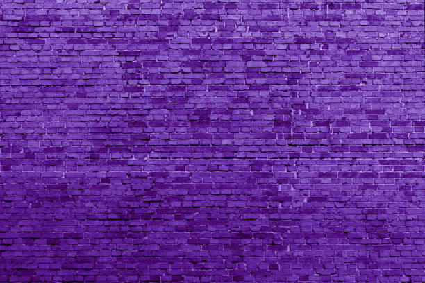 Purple brick building wall background. stock photo
