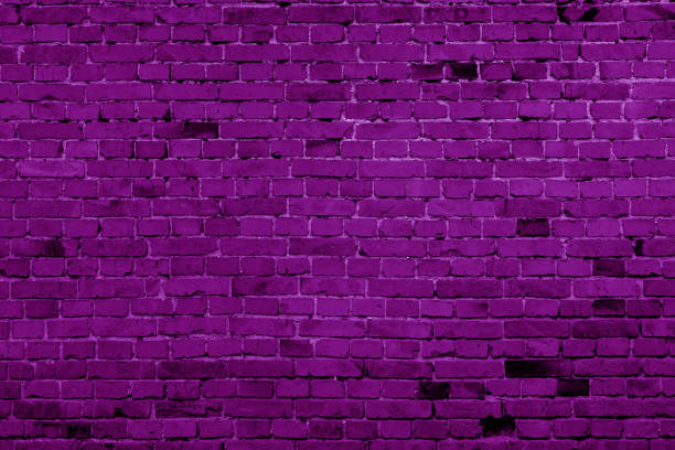 istock Magenta color brick building wall. 1266421420