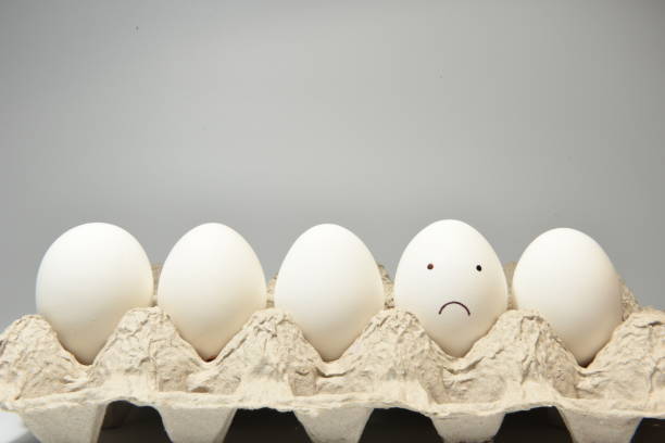Sad face on an egg shell A sad face illustrated on an egg shell sabby stock pictures, royalty-free photos & images