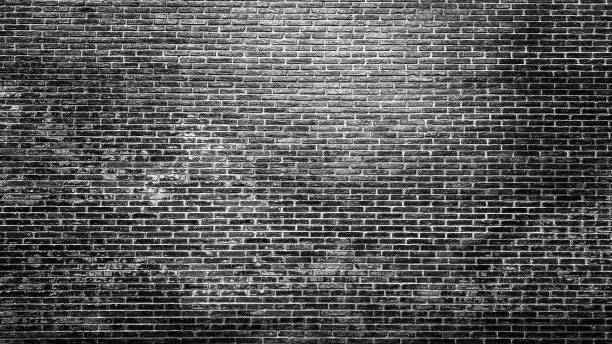 istock Exterior black and white brick wall texture background. 1266426157